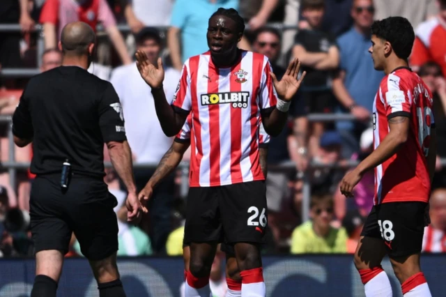Lesley Ugochukwu gestures towards the referee