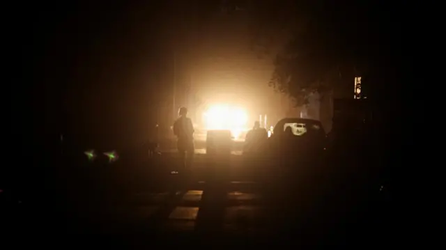 A person walks by in a blackout