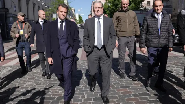 Britain's Prime Minister Keir Starmer walks with French President Emanuel Macron in Kyiv
