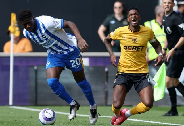 Wolverhampton Wanderers' Nelson Semedo in action with Brighton & Hove Albion's Carlos Baleba