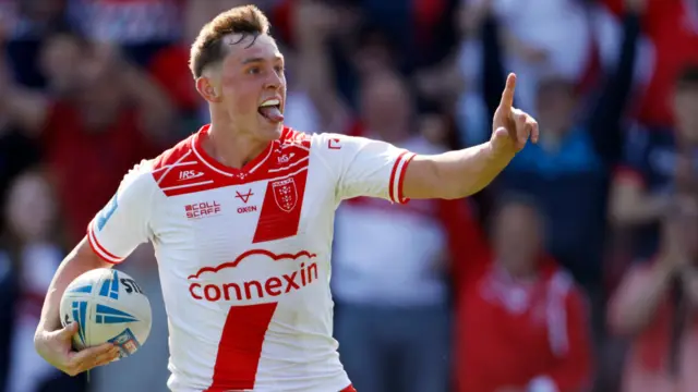 Jack Broadbent celebrates in the process of scoring a try