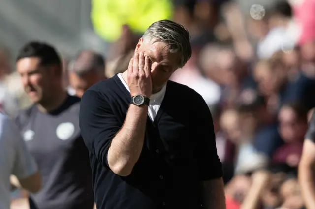 Motherwell manager Michael Wimmer looks dejected during a William Hill Premiership match between Heart of Midlothian and Motherwell at Tynecastle Park