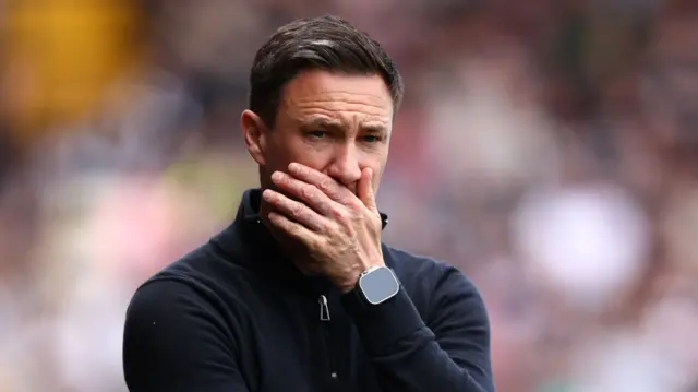 Stuart Maynard covers his face