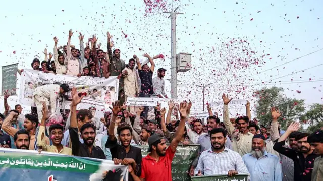 People celebrate following a ceasefire