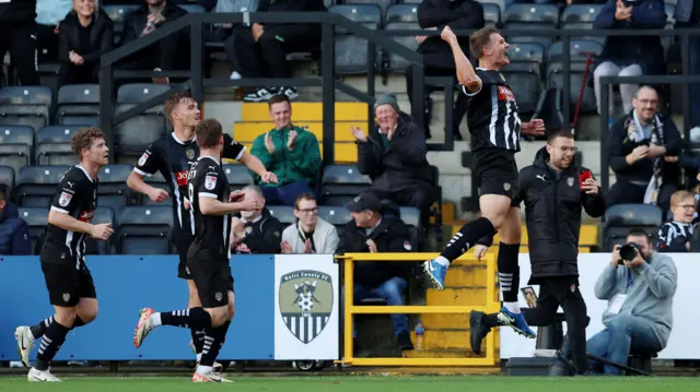 Matthew Platts celebrates his winner against Wimbledon