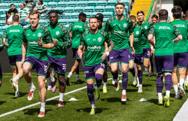 Hibs players warming up at Celtic Park