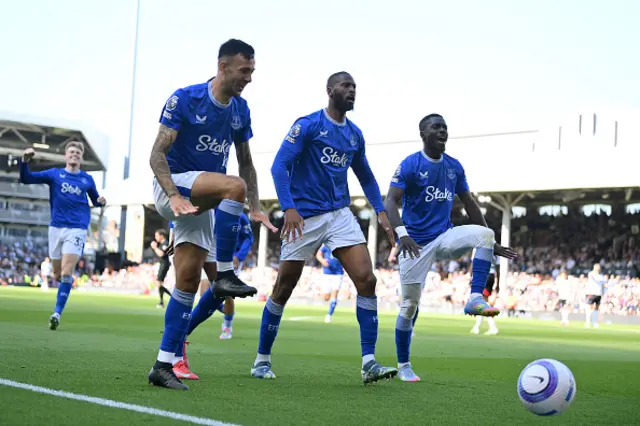 Beto of Everton celebrates scoring his team's third goal with teammates Dwight McNeil and Idrissa Gueye