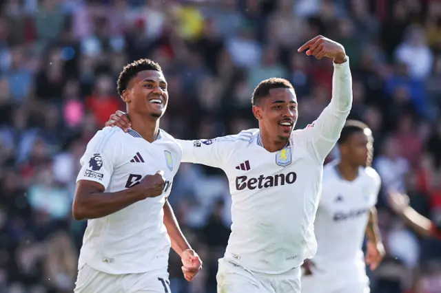 Ollie Watkins (L) celebrates
