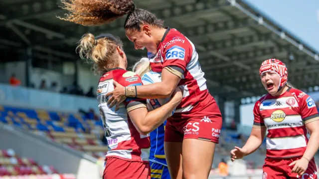 Wigan celebrate Anna Davies' try