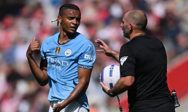 Manchester City's Manuel Akanji remonstrates with referee Tim Robinson