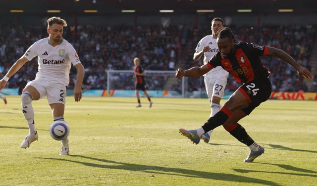 Aston Villa's Matty Cash in action with AFC Bournemouth's Antoine Semenyo