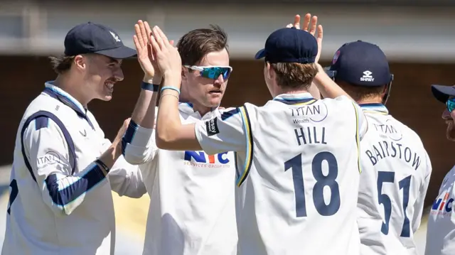 Dan Moriarty takes a wicket