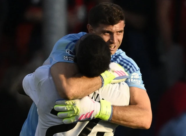 Aston Villa's Amadou Onana and Emiliano Martinez celebrate
