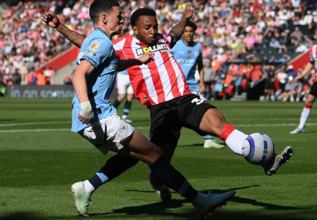 Manchester City's Phil Foden in action with Southampton's Welington