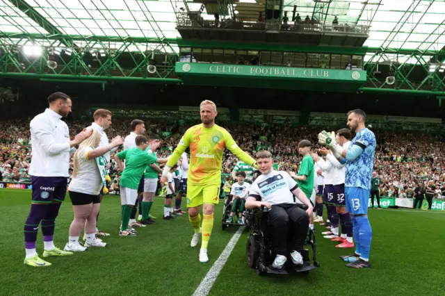 Hibs and their mascots form a guard of honour for the champions