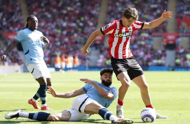 Manchester City's Josko Gvardiol in action with Southampton's Tyler Dibling