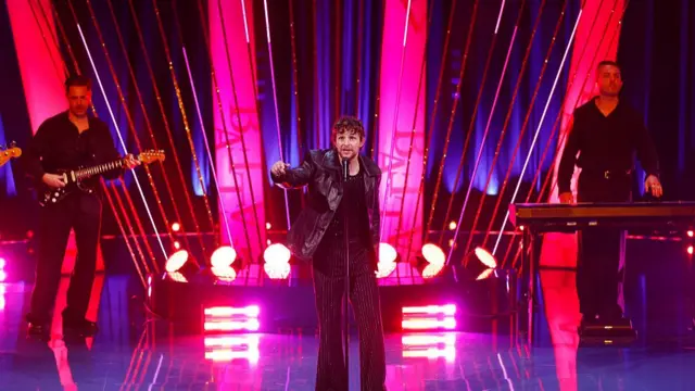 Tom Grennan performing at the 2025 Bafta TV Awards in black leather jacket and all-black ensemble