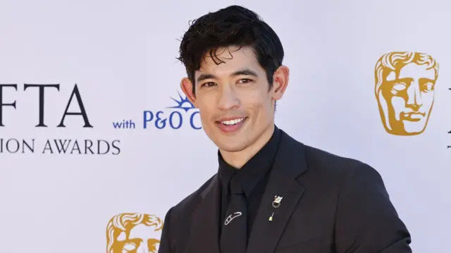 Christopher Chung in a suit