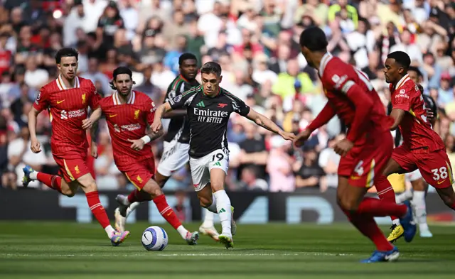 Leandro Trossard of Arsenal runs with the ball during the Premier League match between Liverpool FC and Arsenal FC at Anfield on May 11, 2025 in Liverpool, England.