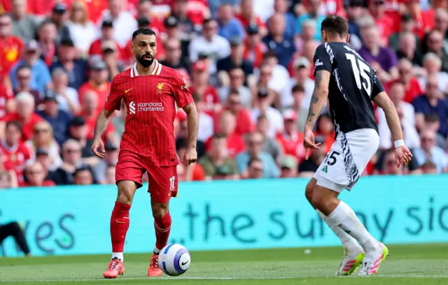 Mohamad Salah (L) of Liverpool in action