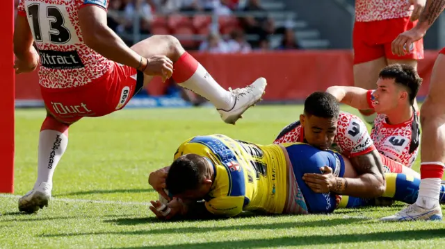 Paul Vaughan crosses the line for Warrington against Leigh