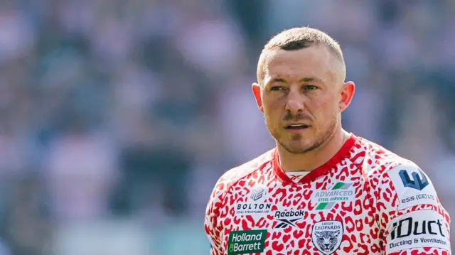 Leigh's Josh Charnley looks on