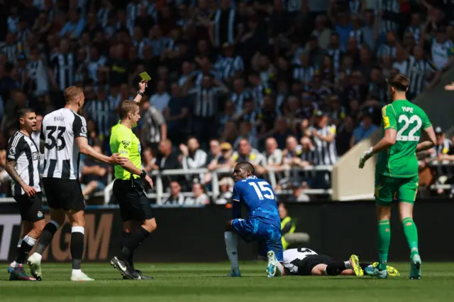 Chelsea's Nicolas Jackson is shown a yellow card by referee John Brooks