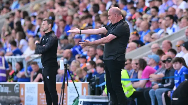 Paul Cook on the touchline
