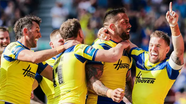 Warrington celebrate Paul Vaughan's try against Leigh