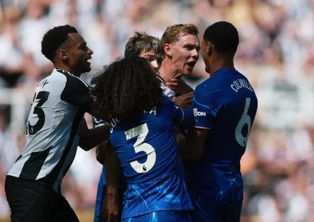 Newcastle United's Emil Krafth clashes with Chelsea's Levi Colwill