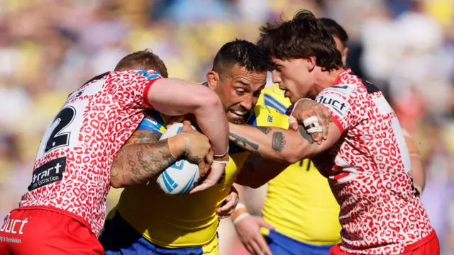 Warrington's Paul Vaughan is tackled