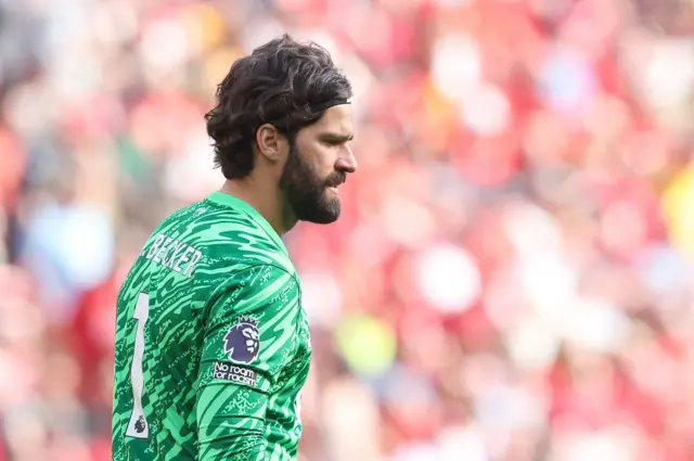 Goalkeeper Alisson Becker of Liverpool looks on