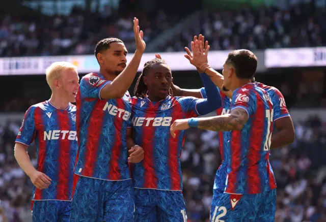 Crystal Palace's Eberechi Eze celebrates scoring their second goal with Maxence Lacroix and Daniel Munoz