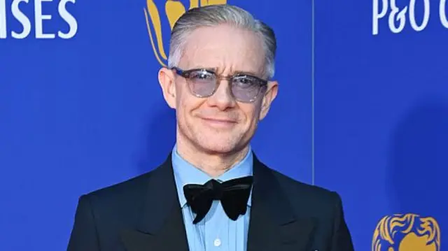 Martin Freeman in a blue shirt and bow tie