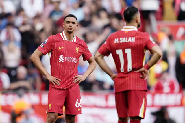 Liverpool's Trent Alexander-Arnold (left) and Liverpool's Mohamed Salah stand dejected
