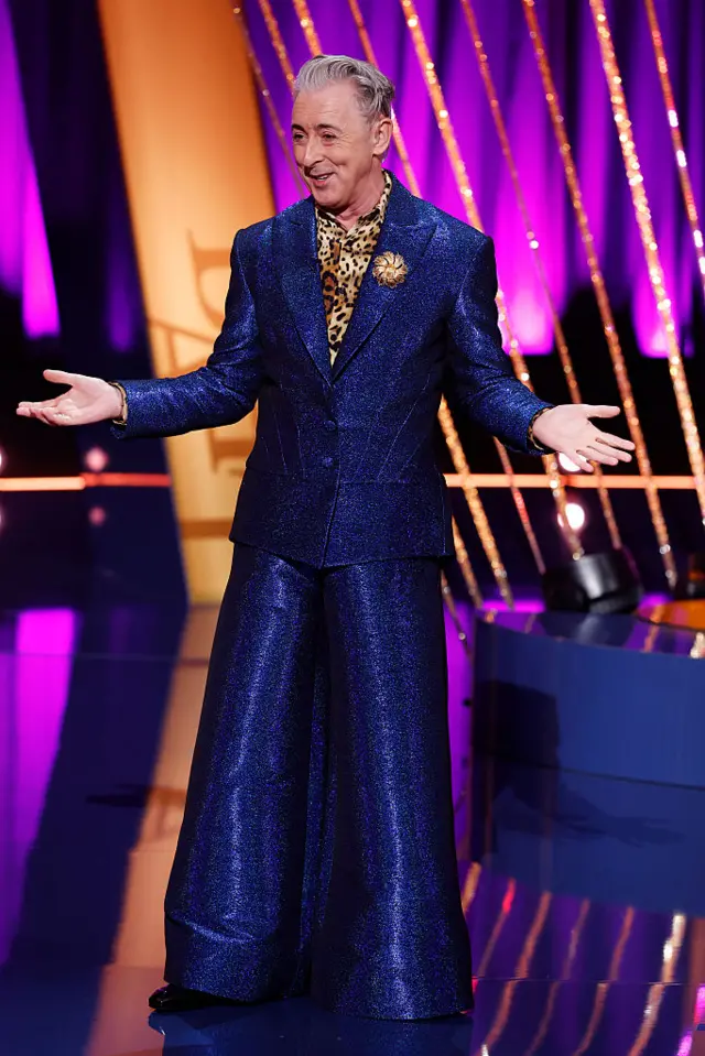 Alan Cumming in blue suit