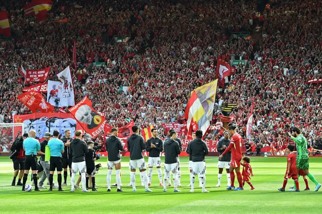 Liverpool's players receive a guard of honour from the Arsenal players ahead of kick-off in the English Premier League football match between Liverpool and Arsenal
