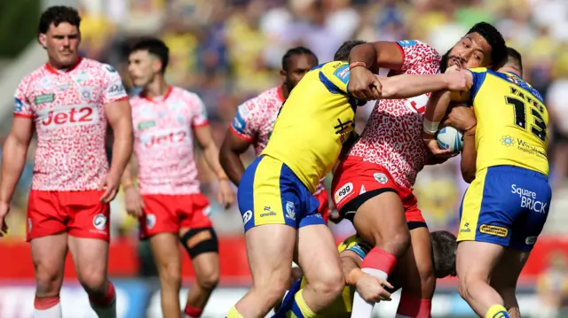 Leigh hold the ball against Warrington