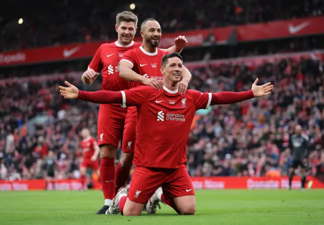 Fernando Alonso celebrates scoring in the Liverpool legends game