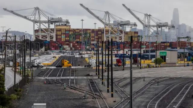 Shipping containers are seen at the port of Oakland