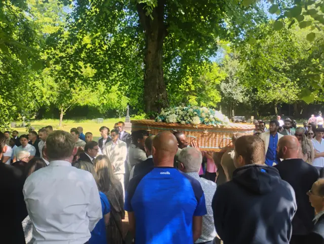 Coffin arrives at church