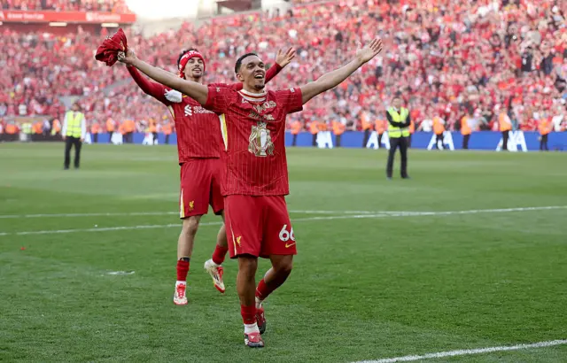 Trent Alexander-Arnold celebrates in front of the Kop