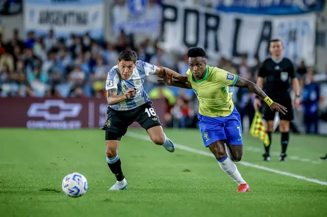 Nahuel Molina of Argentina and Vinicius Jr of Brazil