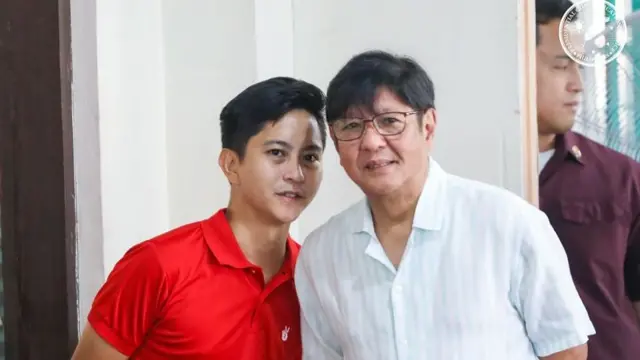 Bongbong Marcos and his son Sandro standing close to each other and looking in the same direction, both with slight smiles on their faces