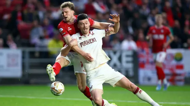 Rob Dickie brings down Kieffer Moore