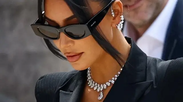 Kim Kardashian's face zoomed in with a large diamond necklace