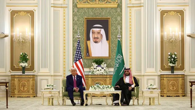 Trump and Mohammed bin Salman sit together in the hall during signing ceremony