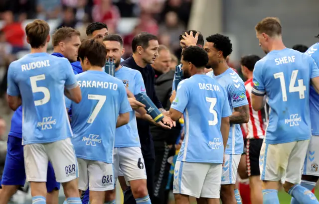 Coventry City head coach Frank Lampard speaks to his players