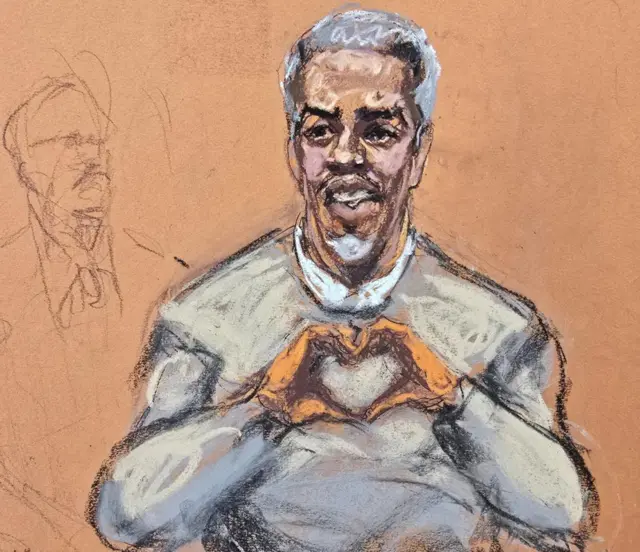 Court sketch shows Sean "Diddy" Combs as Combs makes a hand gesture in the shape of love to family members
