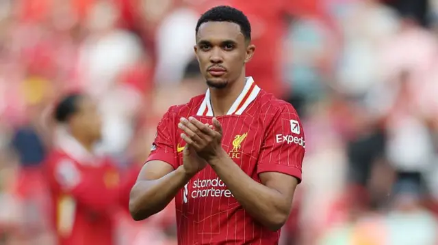 Trent Alexander-Arnold of Liverpool applauds the fans